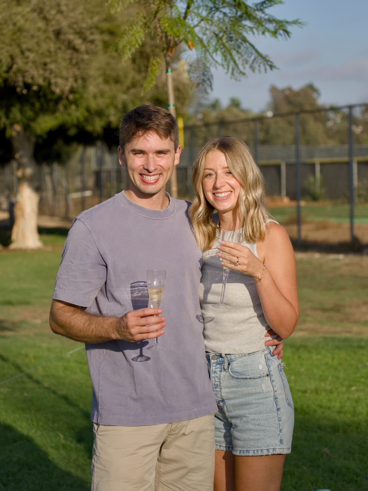 Camille and Zach raising a glass together